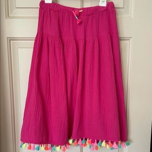 Cute pink skirt with neon tassels. Never worn.